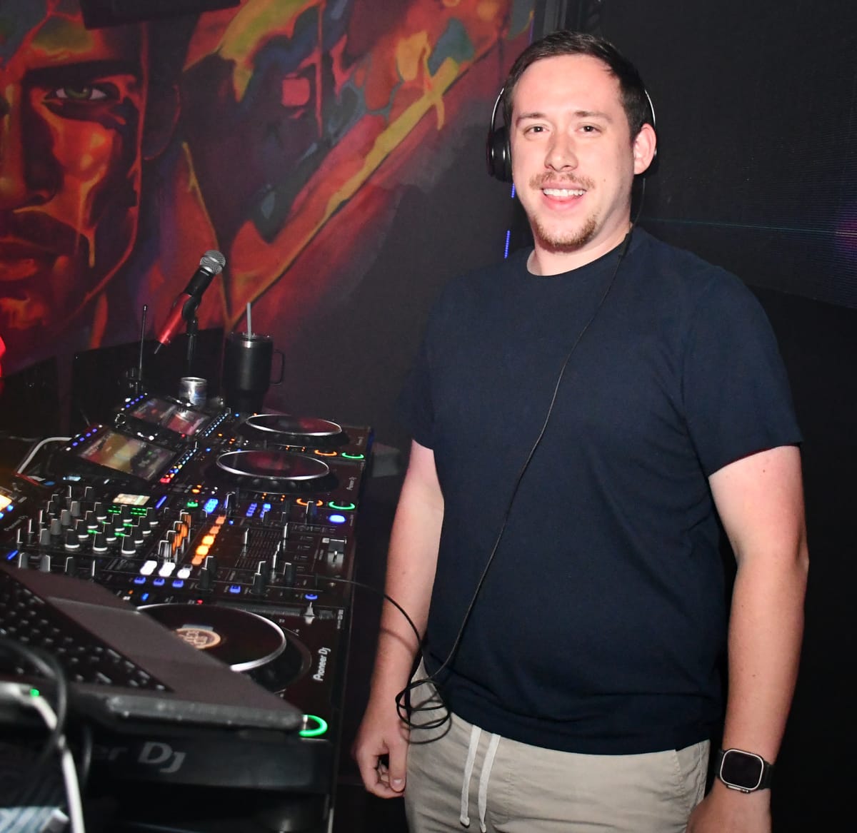 Drew smiling behind the decks at Hunters Nightclub